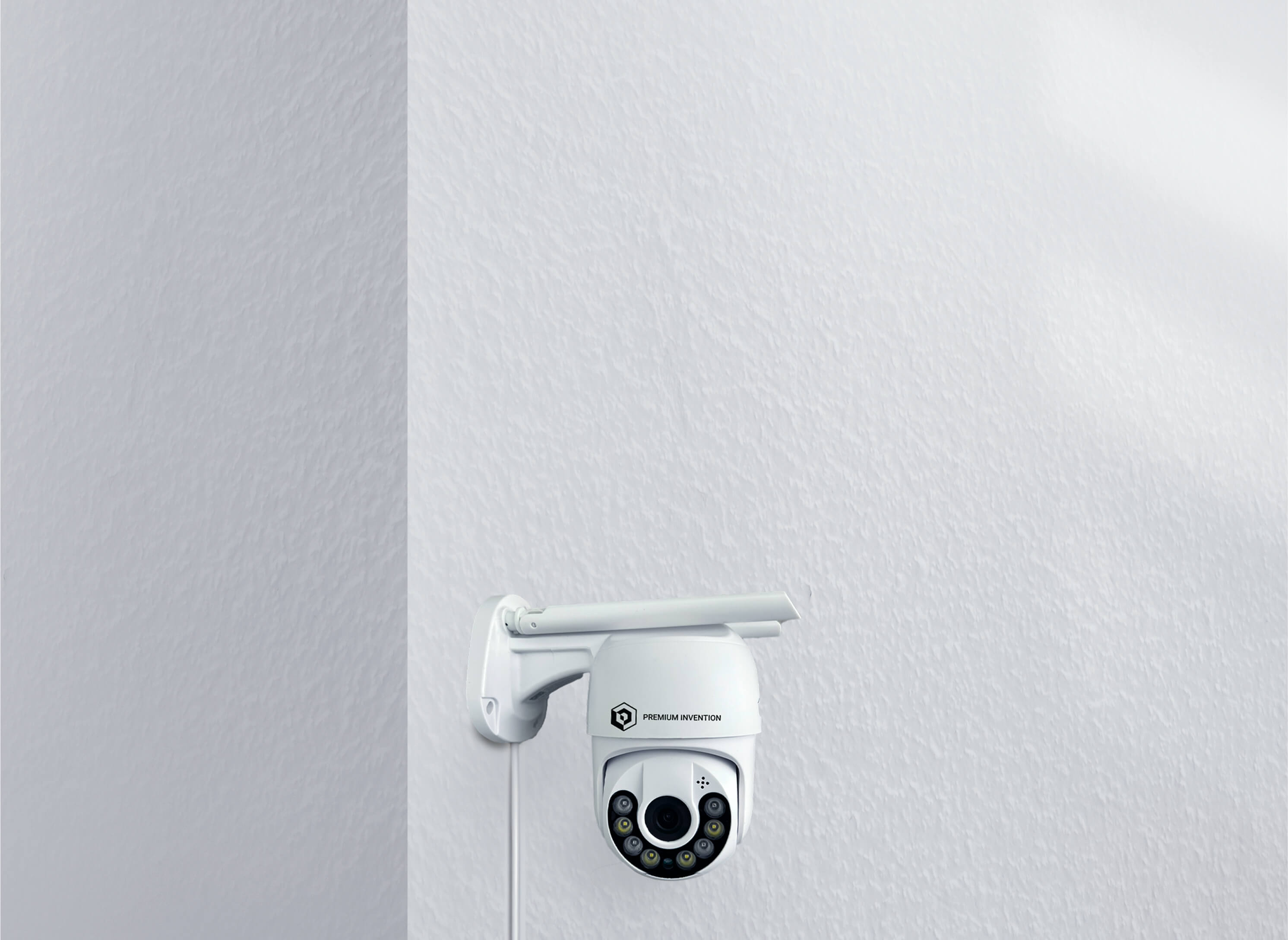 Premium Invention's Wireless X3 Product: a sleek white camera installed on a wall for enhanced security monitoring